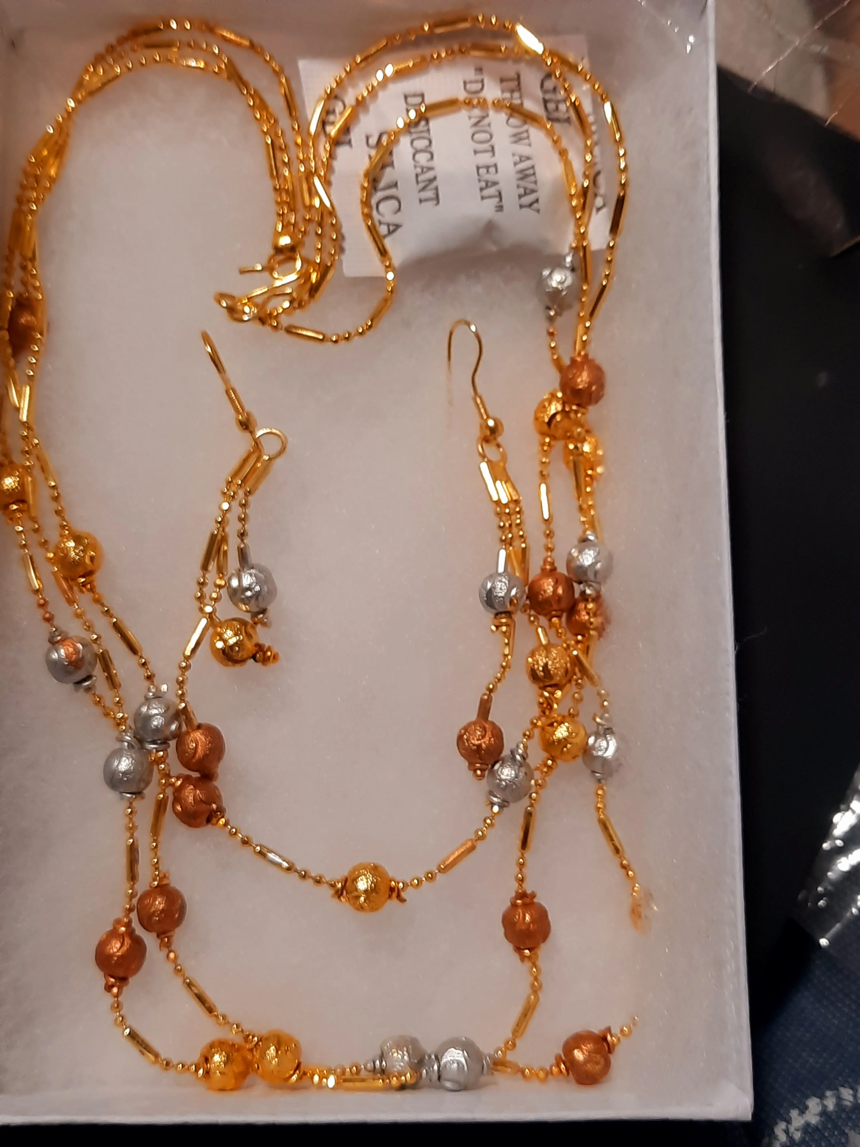Golden jewelry set with beaded golden beads